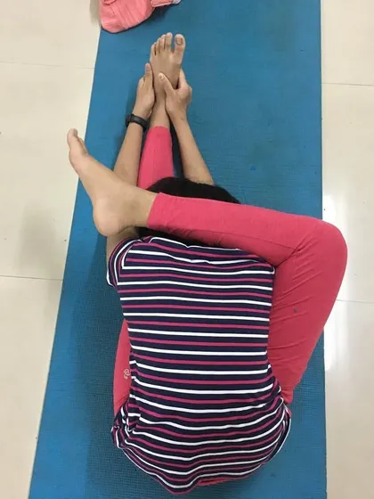 A top-down view of Buddhasana, showing the intricate nature of the pose.