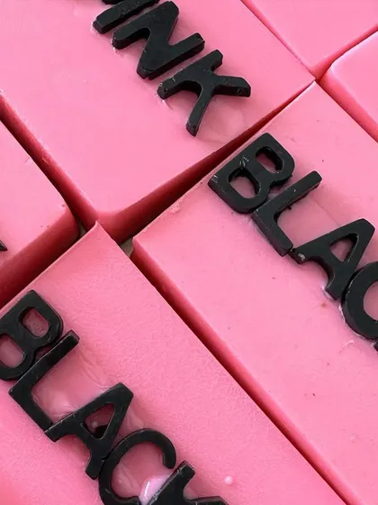A close-up shot of the Blackpink logo soaps, showing the sharp detail and vibrant pink color.