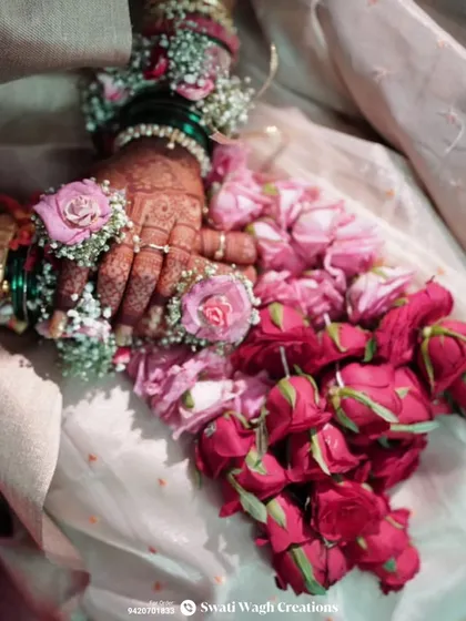 The intricate details of the rose petal kalire. Each flower is carefully attached to create a lush and beautiful accessory that every bride will love.