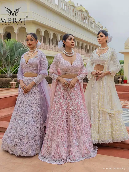 A vision of modern romance in soft pastels. This image showcases a trio of my 'Ruvaah' bridal lehengas in lilac, pink, and ivory, each adorned with intricate 3D florals and fine detailing for a touch of unique elegance.