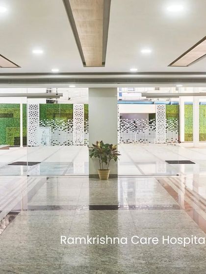 The entrance to Ramkrishna Care Hospital features green walls and open spaces. We integrate these proven strategies to prioritize the well-being of patients, staff, and the environment.