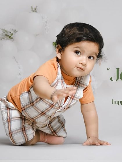 Joyful hearts, happy souls. A curious toddler crawls across the floor of our simple and clean white studio.