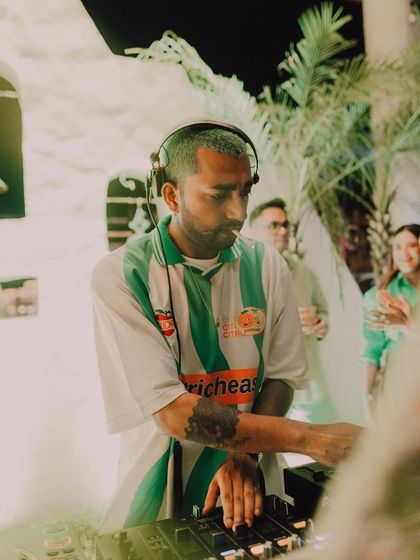 A focused shot of me on the decks in Chandigarh, with the crowd blurred in the background.