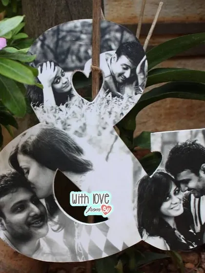 This ampersand-shaped photo collage is the perfect way to celebrate the story of "you and me". It artfully combines several of your favorite black and white photos into a single, meaningful piece of wall art.