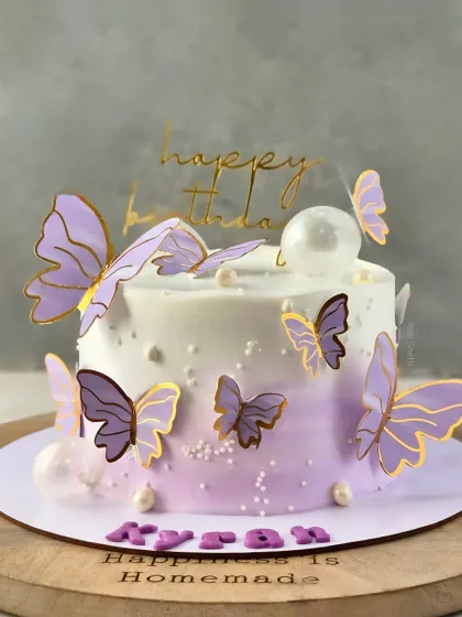 A delicate butterfly theme on a lavender ombre cake, showcasing my signature simple and flavourful style. This is a 1kg Cherry Chocolate Mousse cake.