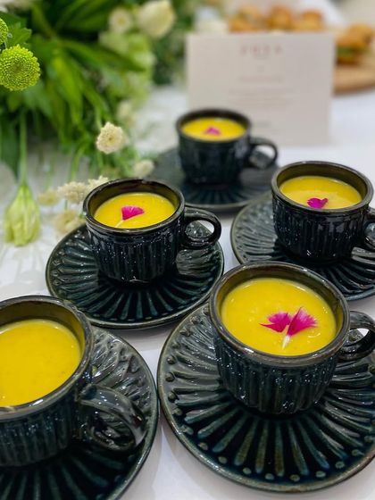 A warm and savory soup served in elegant ceramic cups. This offering provided a comforting and sophisticated option for guests at the Zoya launch.