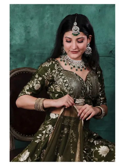 A closer, candid-style shot focusing on the details of the blouse and the model's expression. This type of image adds a personal touch to a lookbook, highlighting the fine craftsmanship of the attire and jewellery.