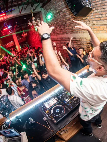 A high-angle shot of me conducting the crowd at Roxy, Kolkata. It is an amazing feeling to have everyone moving to the same beat.
