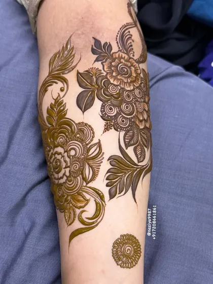 A collection of different floral motifs on the arm. This shows how I can create multiple small designs for a group of friends.