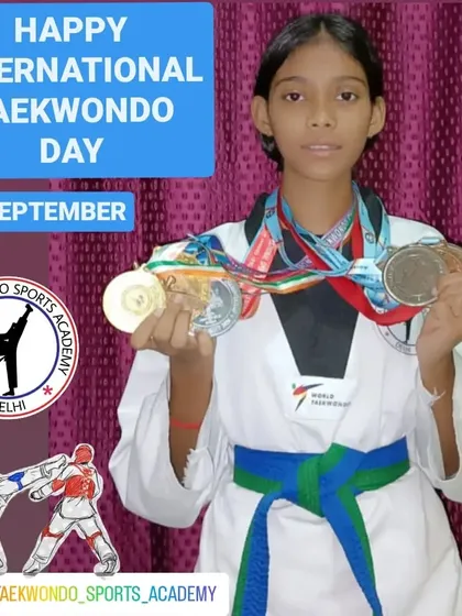 Kokshi Taank proudly displays her medals. We are especially focused on empowering our female athletes to become strong competitors.