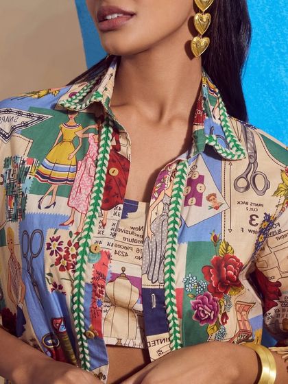 A detailed close-up of the "Boutique Shirt" from Qala Clothing, showing the intricate and playful print of the fabric.