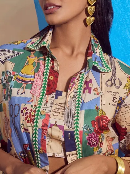 A detailed close-up of the "Boutique Shirt" from Qala Clothing, showing the intricate and playful print of the fabric.