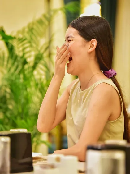Another candid moment of laughter. These are the unposed, genuine moments that truly make a photoshoot special and memorable.