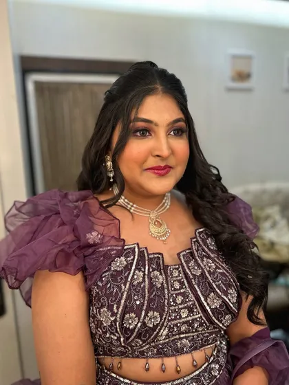 This client chose a dramatic purple outfit, so we went with a matching purple smokey eye and a bold raspberry lip for a stunning party look.