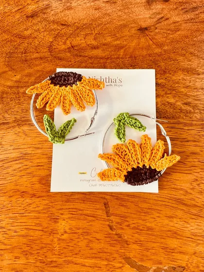 My unique sunflower hoop earrings, carefully crafted with thin cotton threads for maximum neatness and precision. They make a wonderful gift for a friend or yourself.