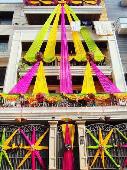 Another angle of the grand house decoration, showing the scale and vibrant colours used to create a festive atmosphere.