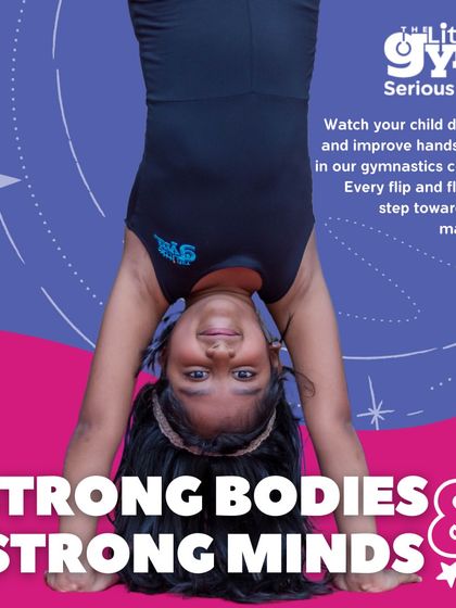 Strong bodies and strong minds are built here. This young gymnast demonstrates incredible focus and strength as she holds a handstand, a skill that requires dedication and practice to master.