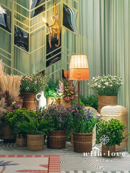 The photo backdrop area at 'The Conservatory' baby shower, with its unique mirrored wall and playful decor.