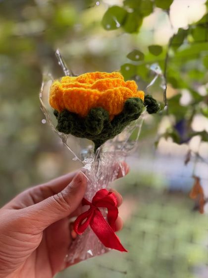 A single yellow rose, symbolizing friendship and joy. The bright color is sure to brighten anyone's day.