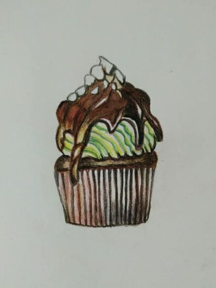 A yummy-looking cupcake with chocolate drizzle, drawn by a student.