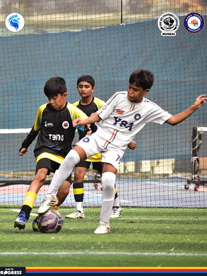 A player skillfully maneuvers the ball away from two defenders. This showcases the confidence and composure we build.