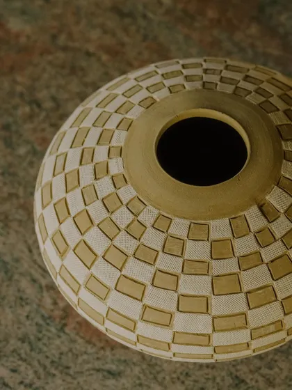 A collection of Prady's finished sgraffito and slip-work pots. His precision with geometric and floral patterns on rounded forms is just incredible.