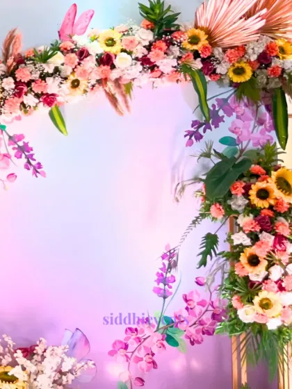 This shot captures the beautiful blend of nature and tradition in our floral Haldi decor, with a stunning array of vibrant blooms against a soft lavender backdrop.