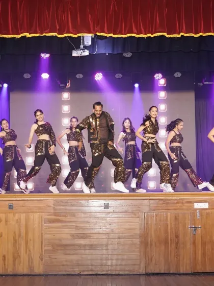 Our adult commercial dance batch in the middle of their high-energy routine. The performance featured intricate choreography and sparkling costumes, proving it's never too late to own the stage.