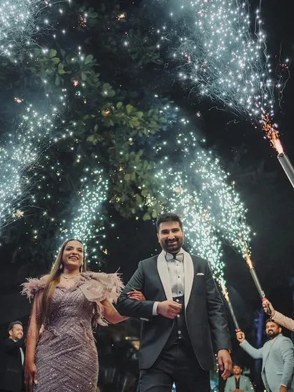 Making a grand entrance to your new life together. I orchestrate spectacular couple entries with dramatic elements like cold pyro, ensuring your arrival is as memorable as the ceremony itself.