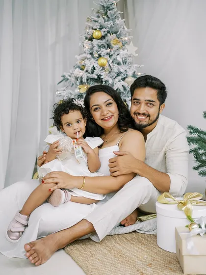 A full family portrait from a Christmas mini-session, with everyone dressed in white for a clean, elegant look.