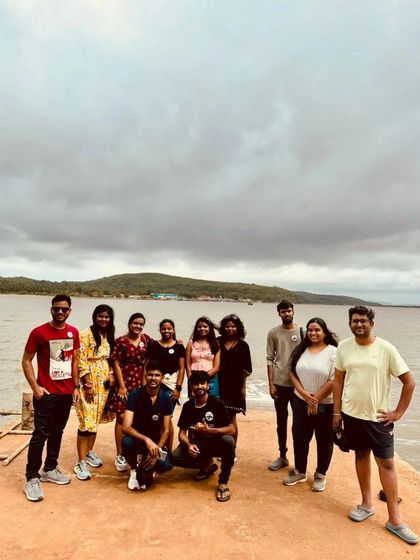 A group photo on the pier, with the calm backwaters behind us.