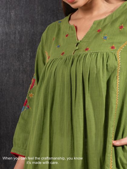 When you can feel the craftsmanship, you know it's made with care. This detail shot of our Paheli green dress shows the delicate gathers and hand embroidery that make it special.