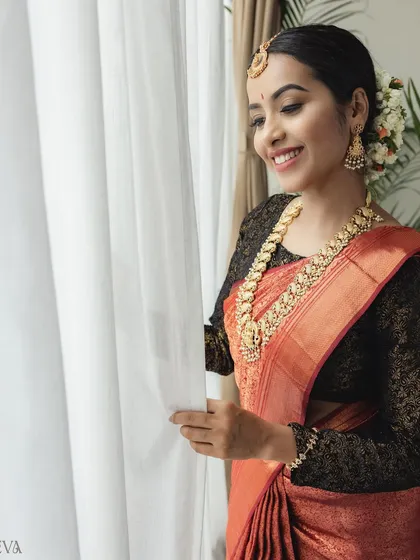 A duplicate of the previous candid shot, capturing the genuine smile and elegance of the model, suitable for lifestyle-oriented ethnic fashion campaigns.
