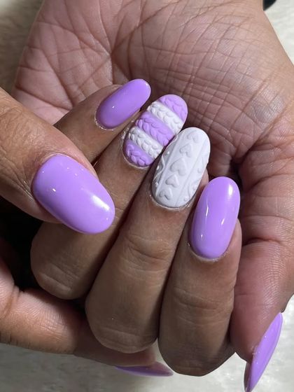 A close-up of the 3D sweater nail texture. This technique adds a fun and tactile element to your manicure, making it a real conversation starter.