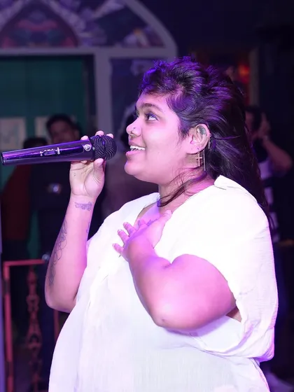 A singer lost in her performance. I provide professional microphones and sound to make every singer feel like a star.