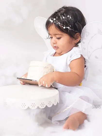 A more destructive approach. This little one decided to flip the cake, which made for a hilarious and unforgettable photo.