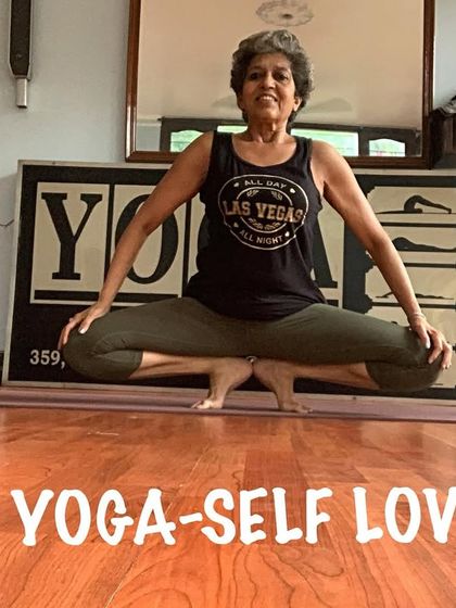 A variation of scale pose, showing the deep core and hip flexor engagement needed to lift the legs.