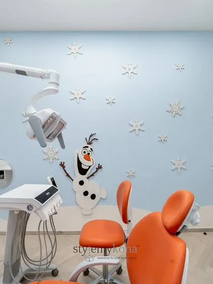 To make a pediatric dental clinic feel less intimidating, I brought the magic of Disney's 'Frozen' to life. This treatment room features a cheerful Olaf, snowflake wall details, and a calming blue palette, creating a friendly and stress-free environment for young patients.