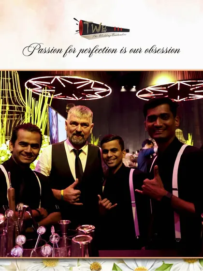 Our bartenders posing with a guest, highlighting the friendly and engaging atmosphere we create at our events.