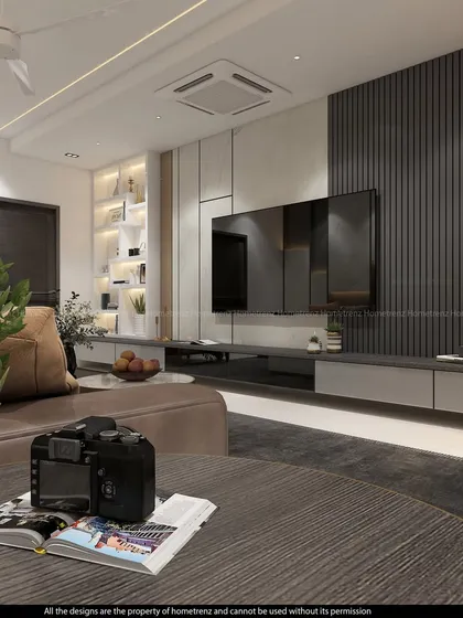 A close-up of a modern TV unit, showing the clean lines and the combination of dark wood and grey laminate.