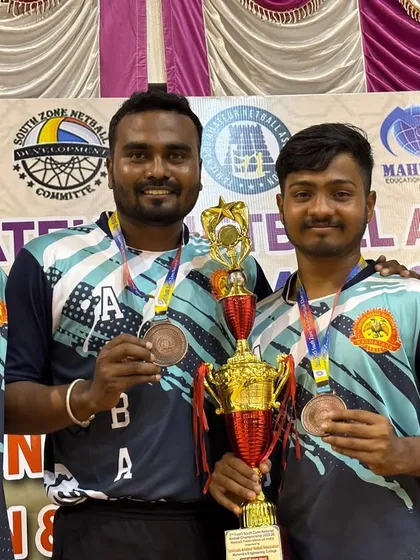 A close-up of our players Srujan, Hitesh, and Chiranjeevi Prakash with their hard-earned bronze medals and championship trophy.