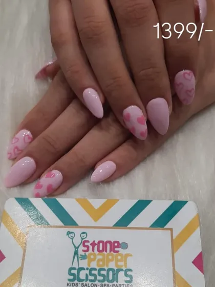 You can never go wrong with a cute pink manicure. This design uses a soft matte pink base with glossy heart accents for a sweet and trendy look, perfect for any occasion.