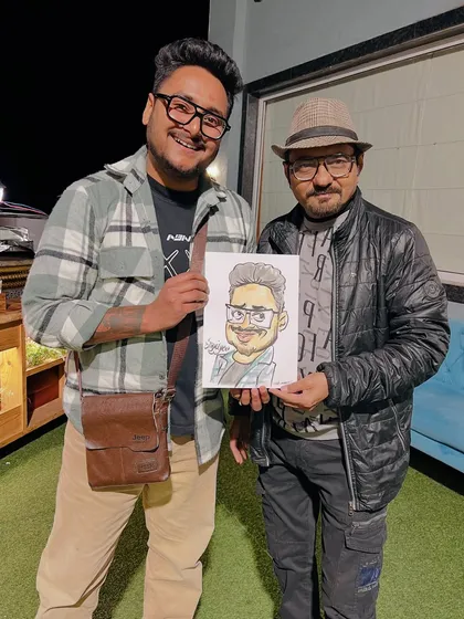 Every face has a story. This guest's energy and attitude are captured in this snapshot with his caricature.