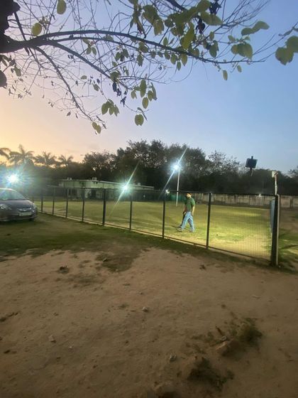 Another view of the park at dusk. The secure fencing and wide-open space mean you can rest easy knowing your dog is in a safe environment while they play.