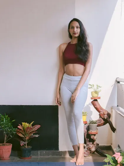 And this is me, Nidhi! Whether I'm in a posture or just taking a moment between classes, my goal is to create a space where you feel comfortable and encouraged. I look forward to welcoming you to the studio.