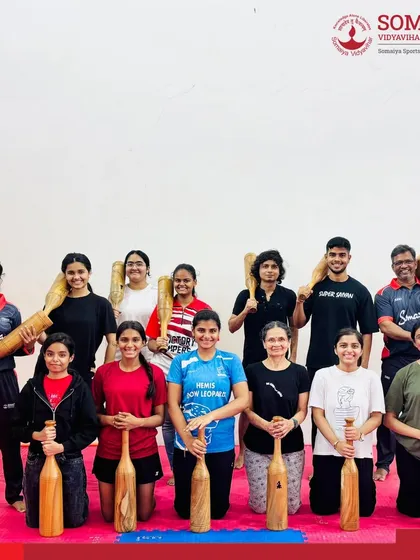 We blend modern sports science with traditional Indian strength training methods. Our athletes are seen here during a Mudgar training session, a unique approach we use to build functional strength, core stability, and endurance.
