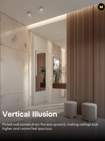 Using fluted wall panels is a great trick to create a vertical illusion. The lines draw the eye upward, making ceilings look higher and rooms feel more spacious, as shown in this elegant entryway.