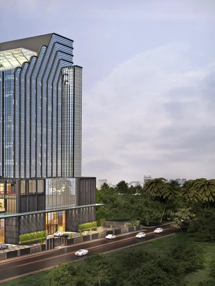 An angled view of the Pullman Hotel, showcasing its dynamic, sculpted form. This bold statement in hospitality architecture is crafted for luxury, experience, and timeless appeal.