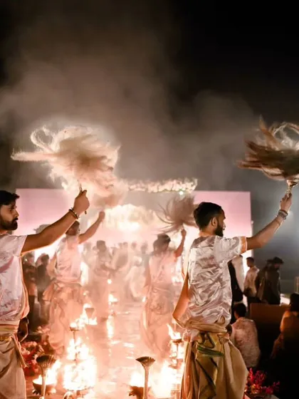We can arrange for powerful traditional ceremonies like this Ganga Aarti to bless your union. The sight of priests performing the ritual with fire and smoke is a truly moving experience.
