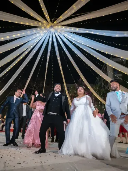 The wedding party takes the stage for a choreographed dance. These are the fun, planned moments that add so much personality to a reception, and I make sure to capture the energy and coordination.